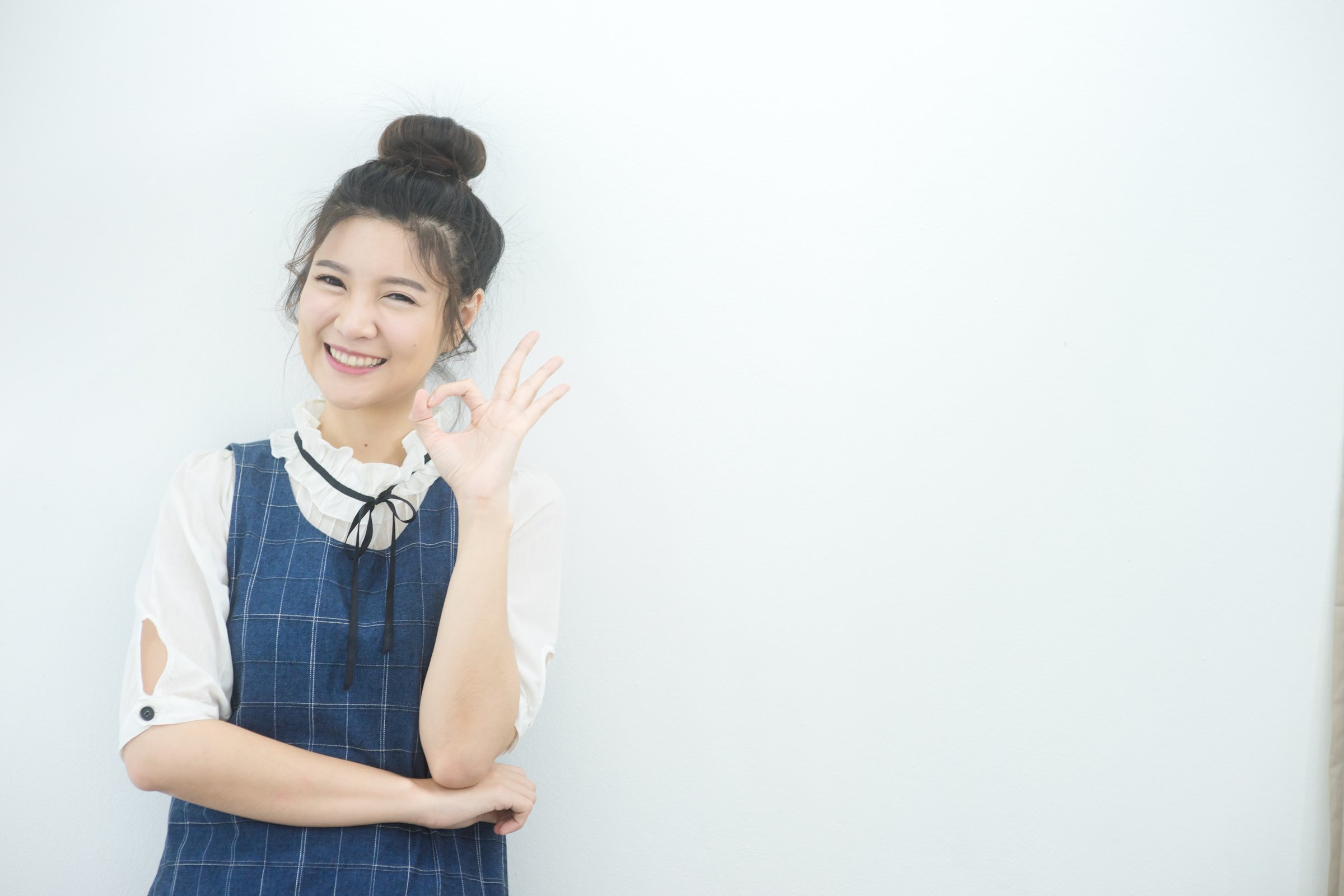 Smiling Woman Doing Ok Sign